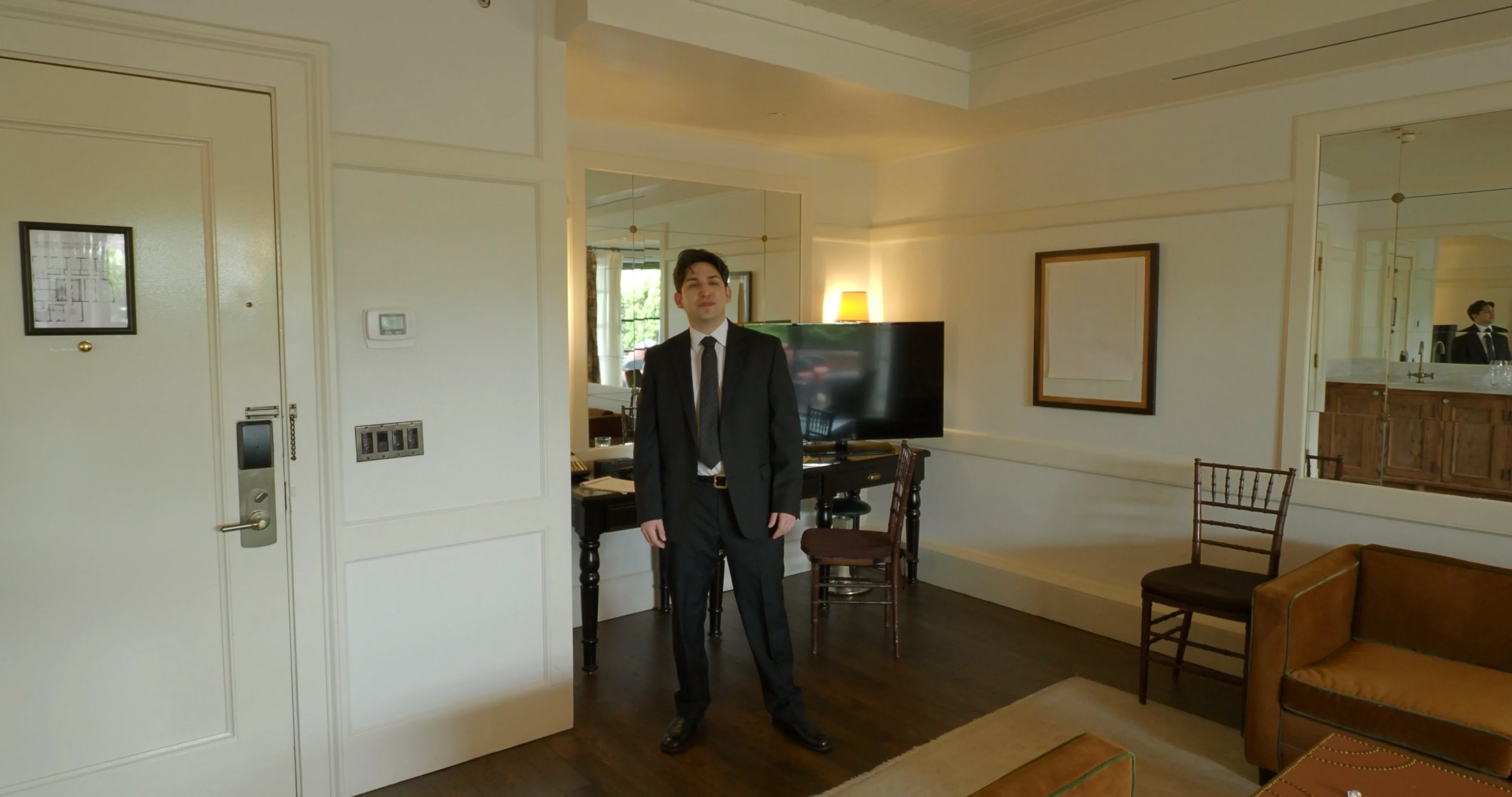 Ian Bloom as The Gangster in Big Time alone in a hotel room interior