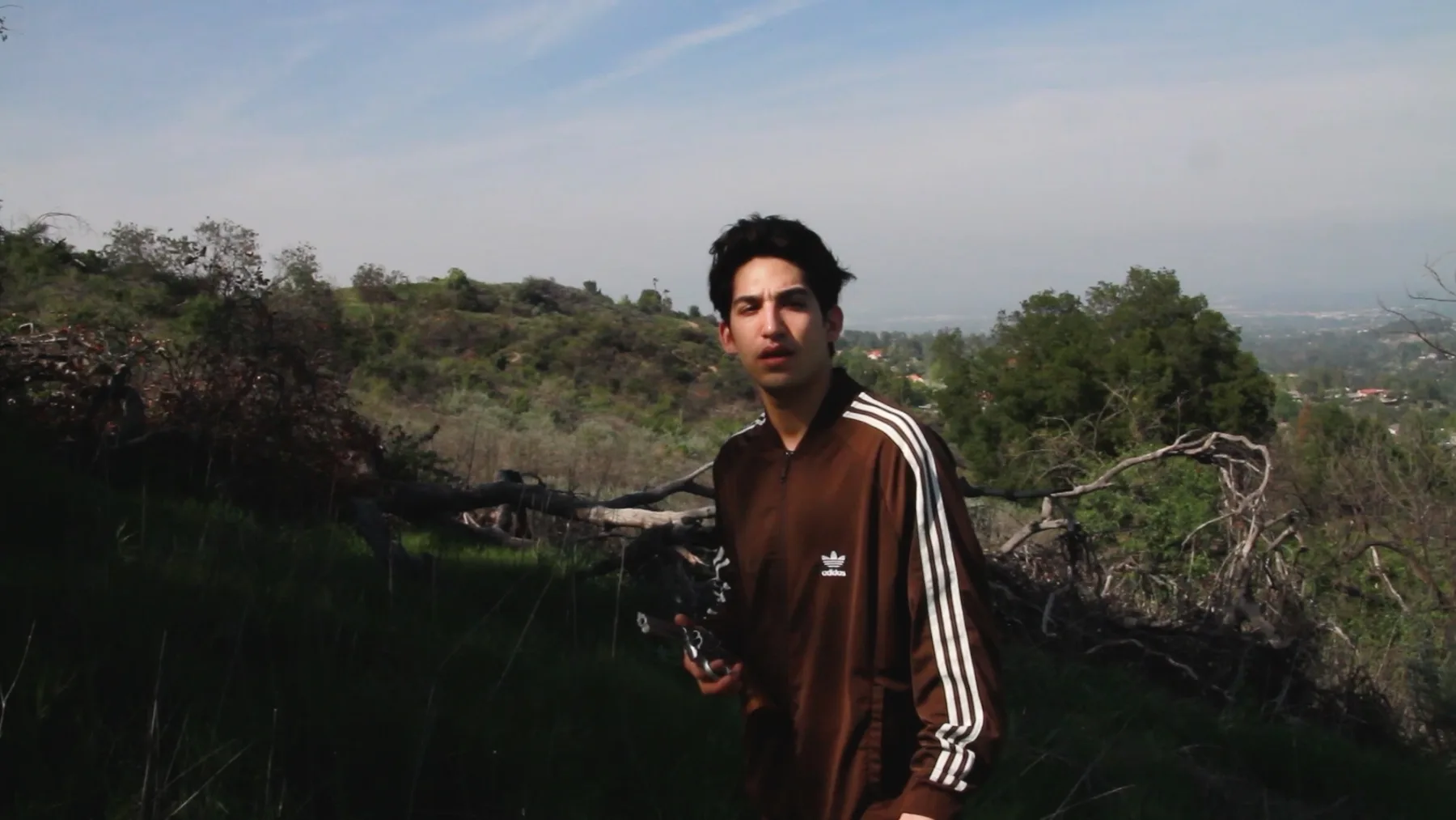 Ian Bloom in Driver 2016 as the Driver looking away with a gun